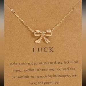 Gold bow necklace